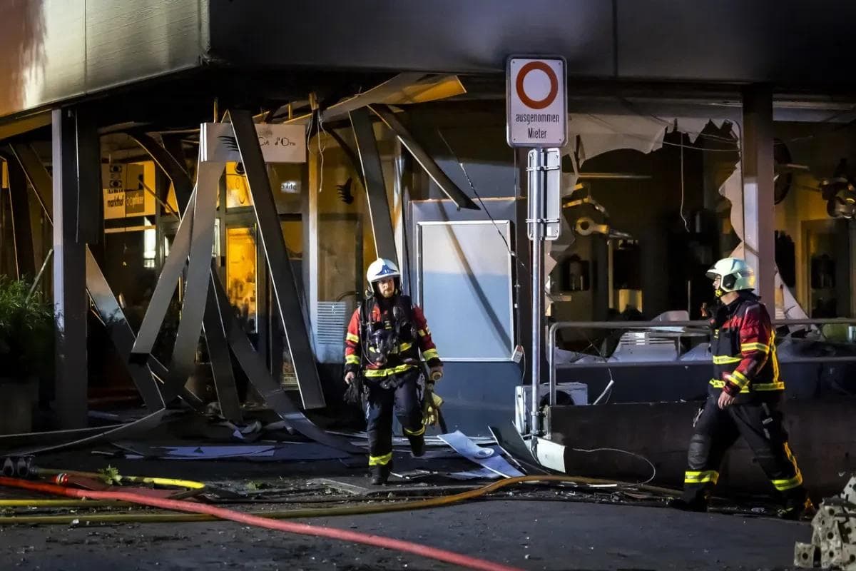 A firefighter assessing the damage caused by the explosion